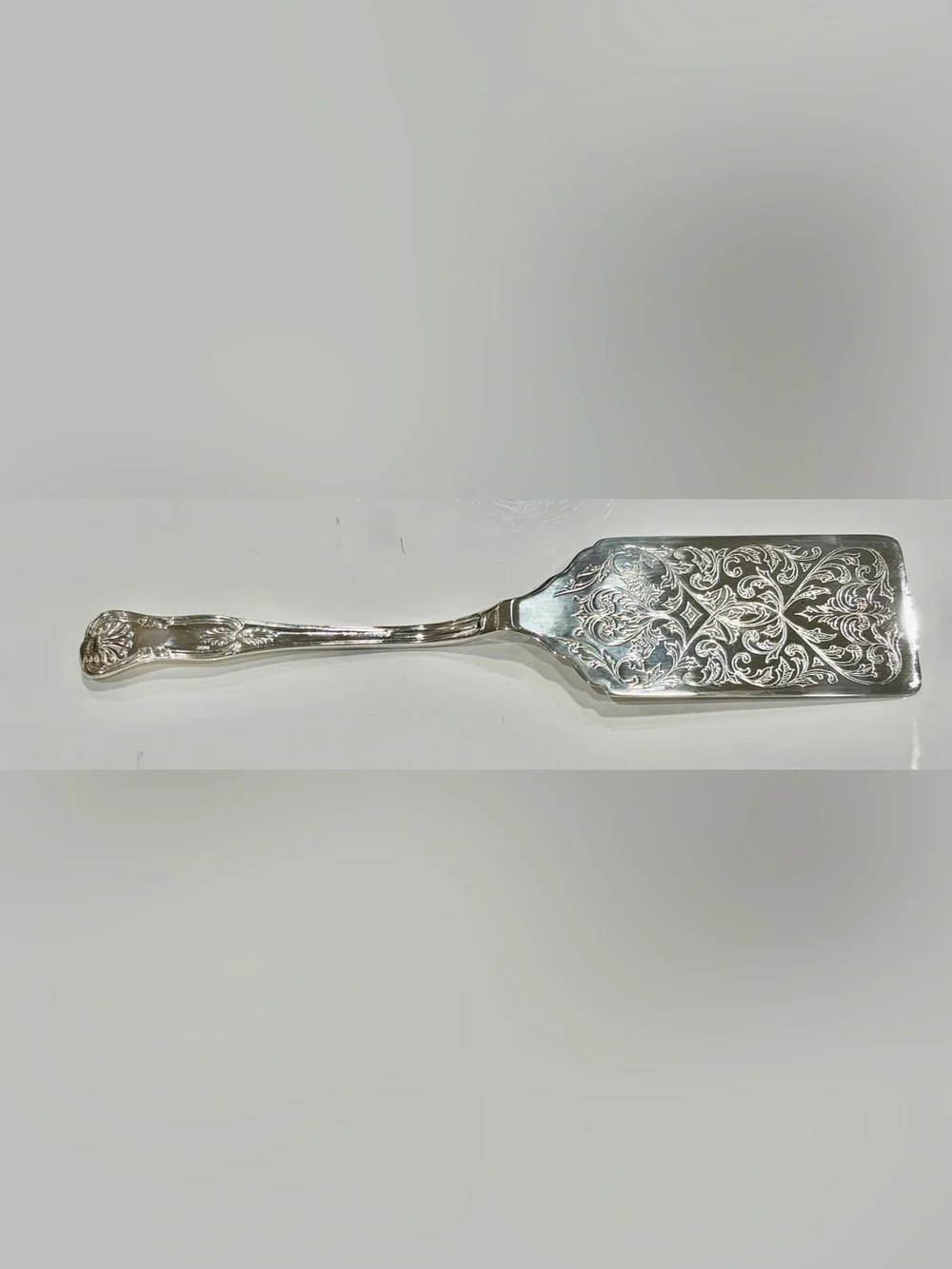 Vintage Polished Silver-Plated Server with Ornate Engraved Details